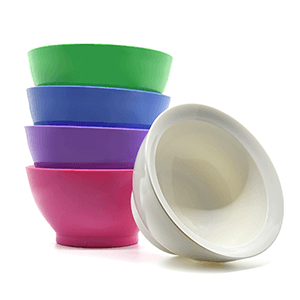 Stack of pink, purple, blue, and green 20 oz bowls, with a white bowl on its side